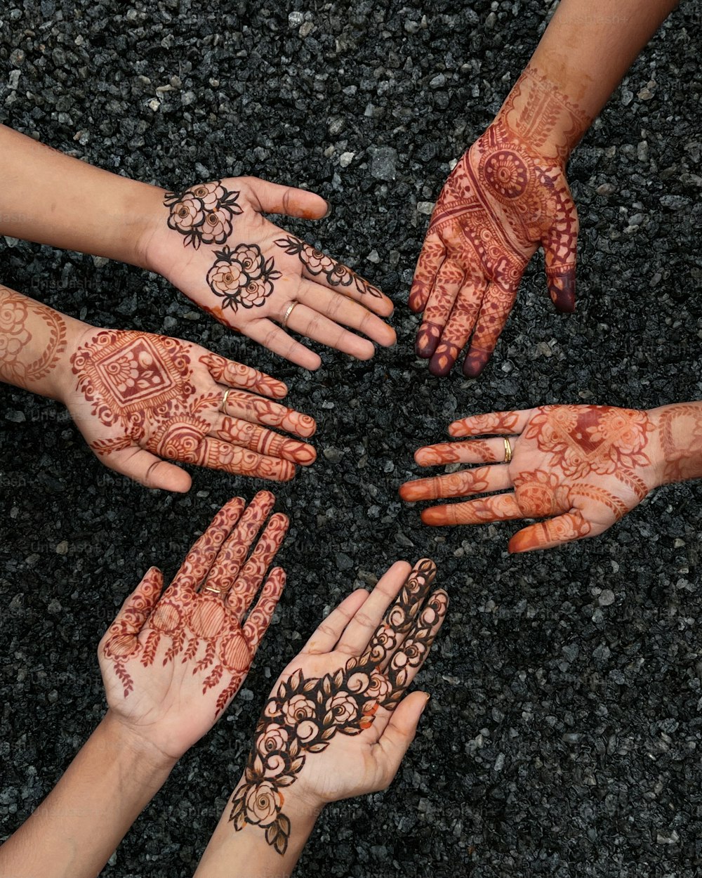 a group of people with their hands together