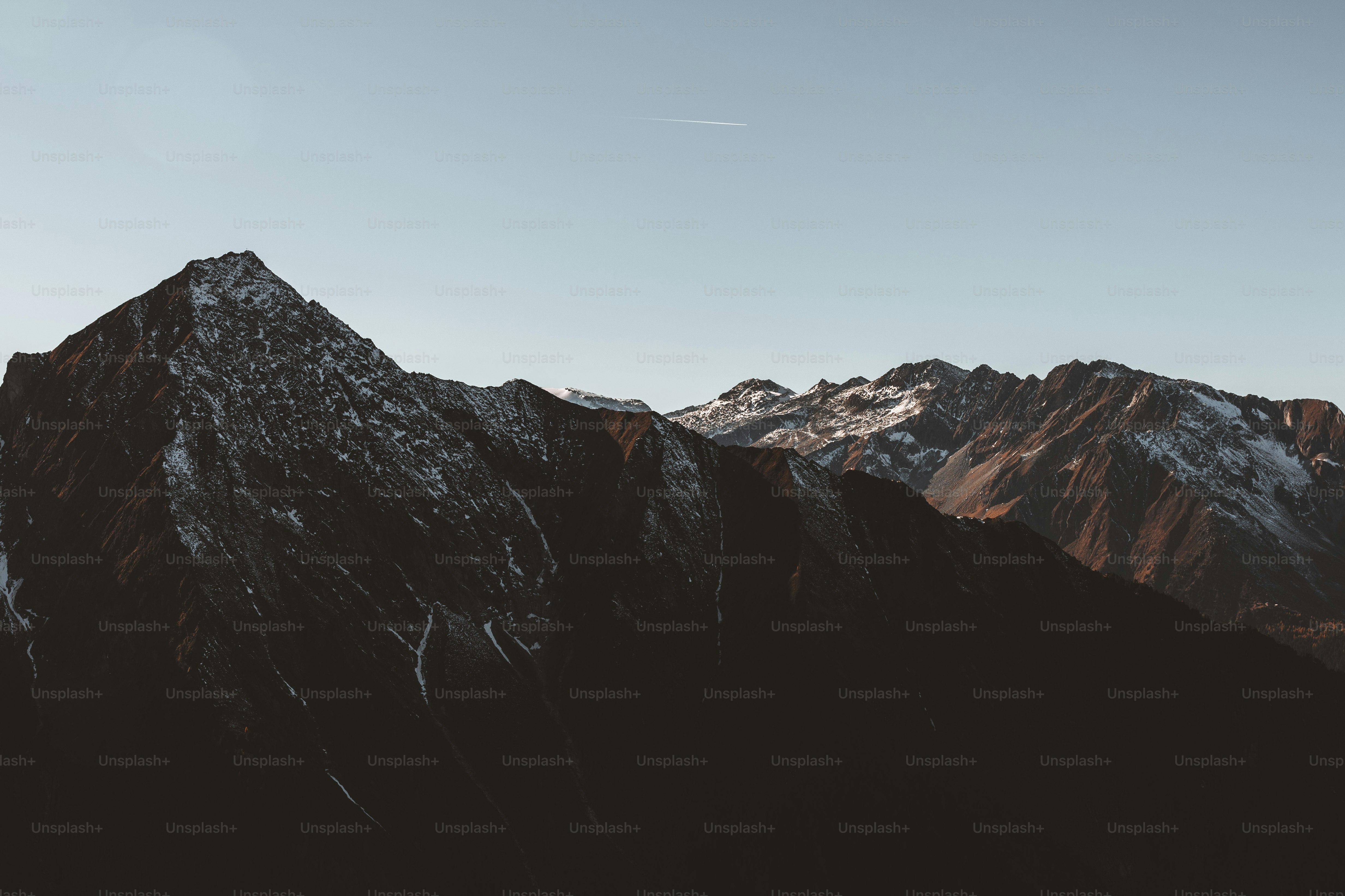 the top of a mountain with snow on it