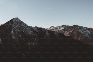 the top of a mountain with snow on it