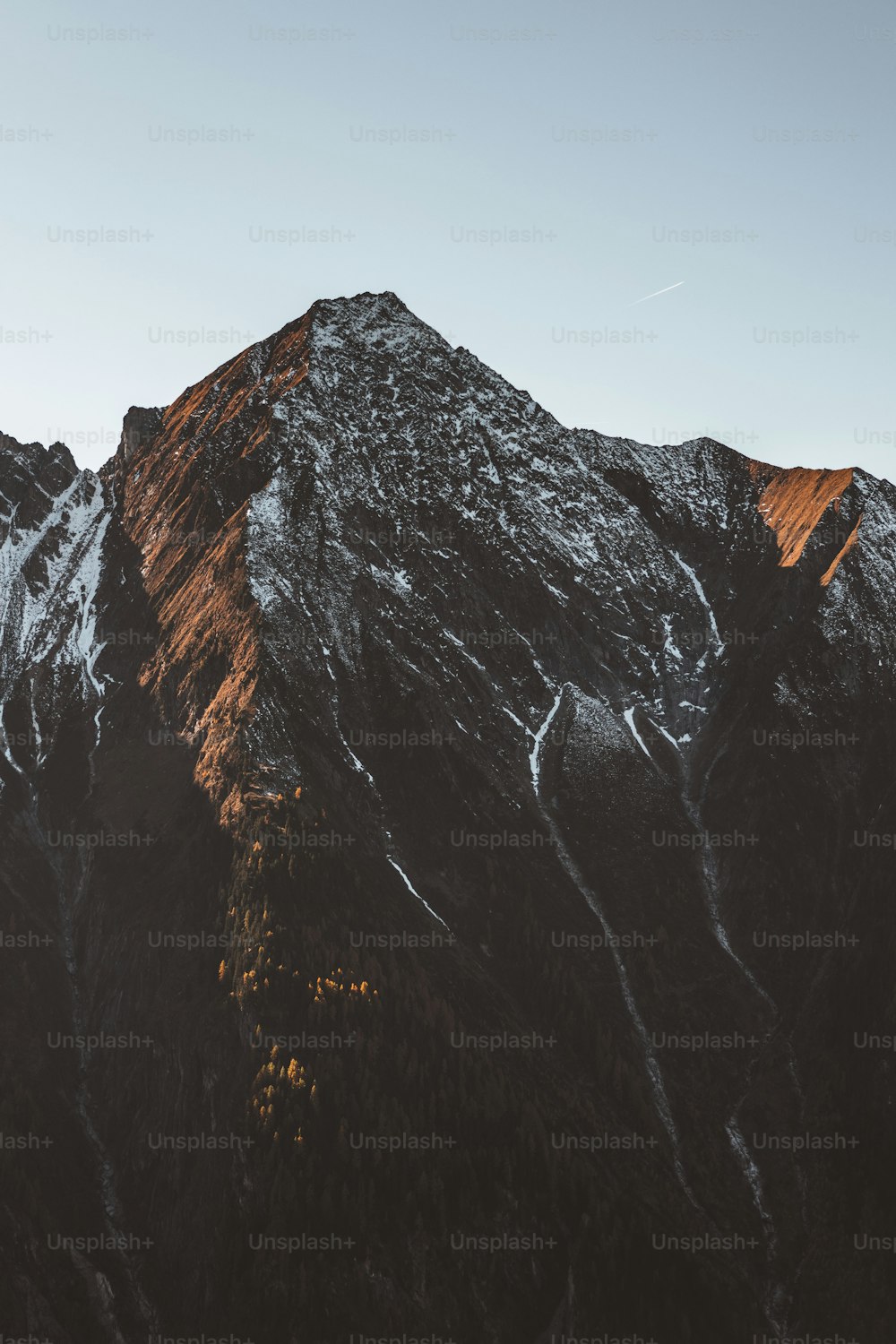 the top of a mountain with snow on it