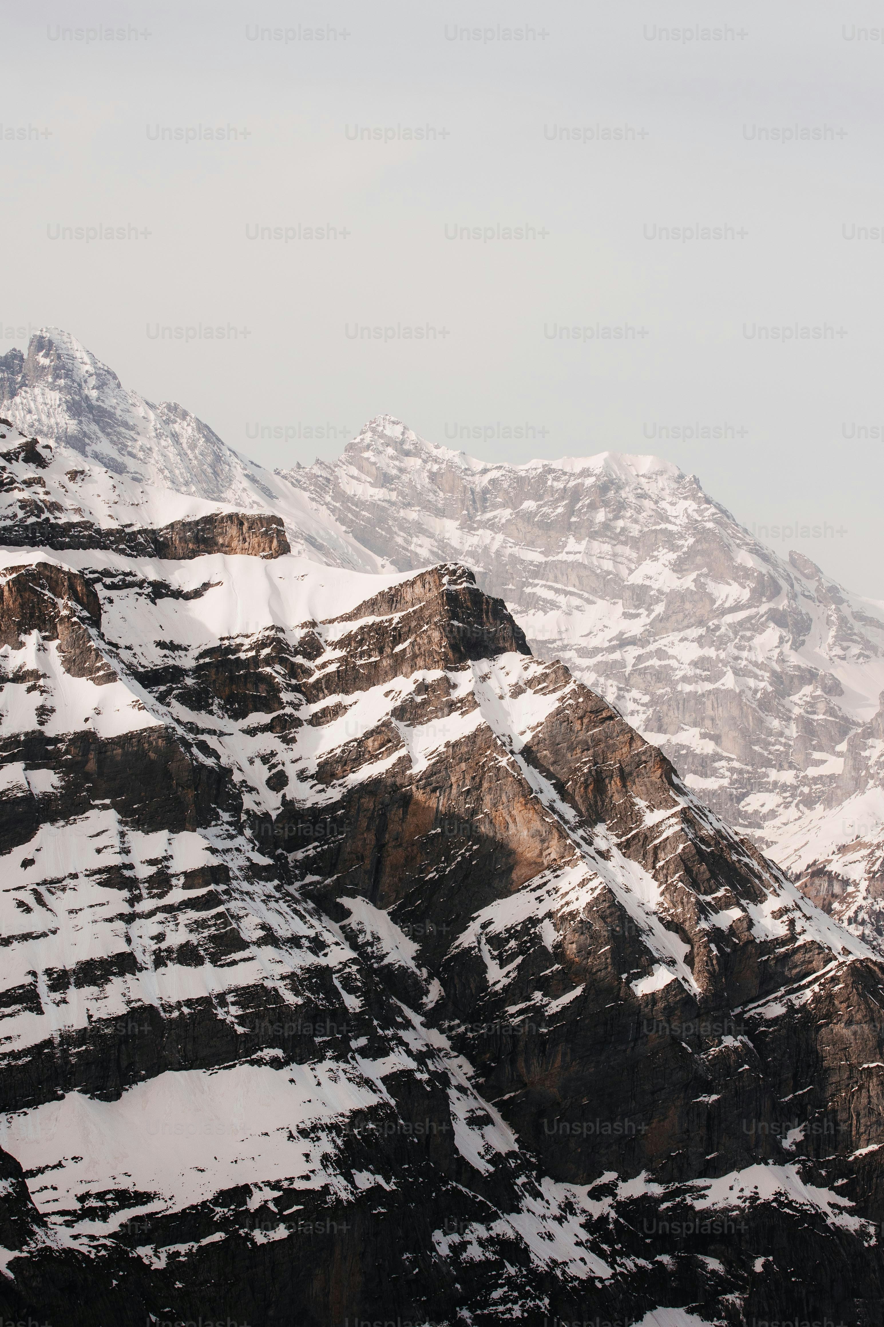 a snow covered mountain with a sky background