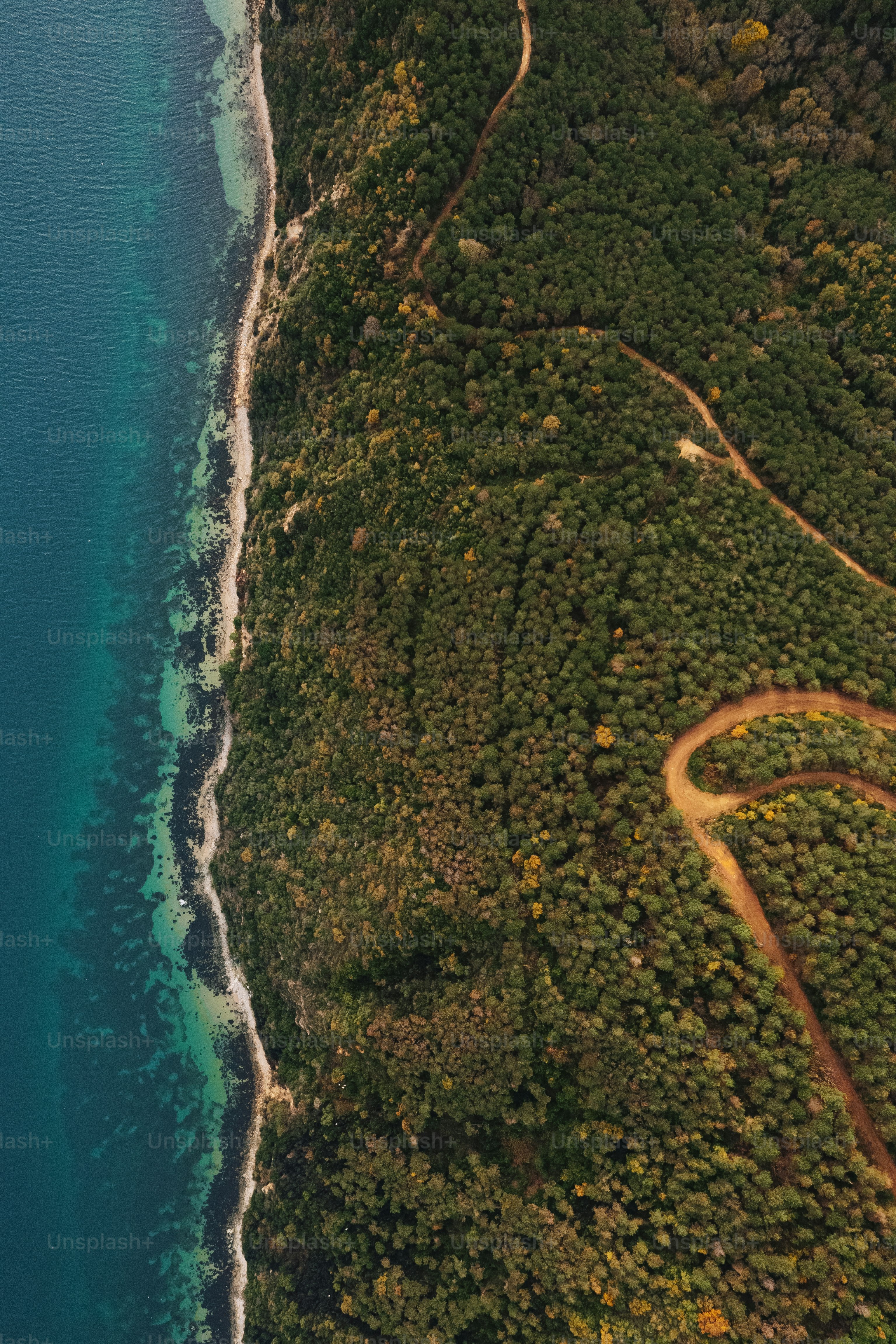 an aerial view of the ocean and land