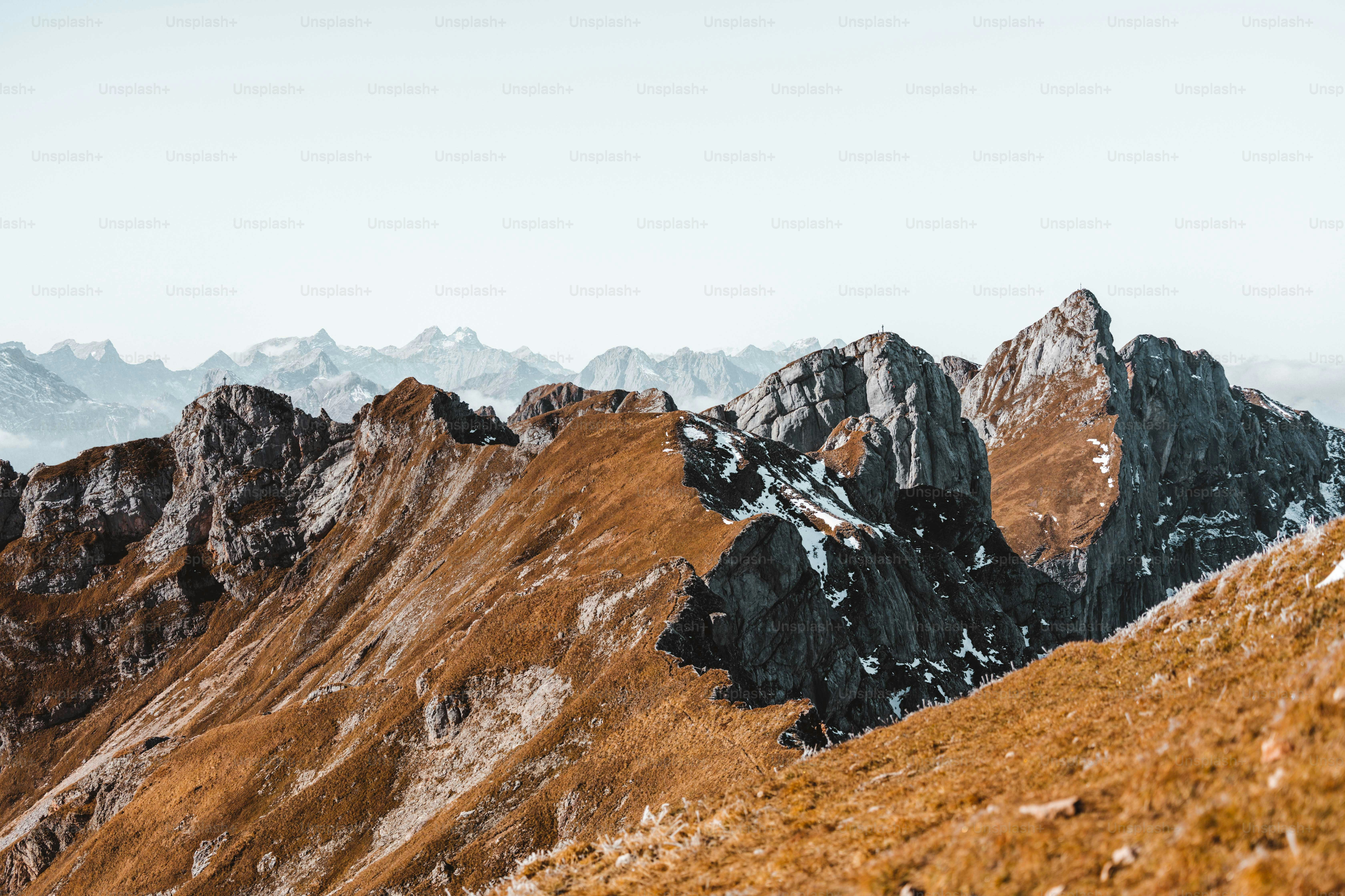 a group of mountains with snow on them