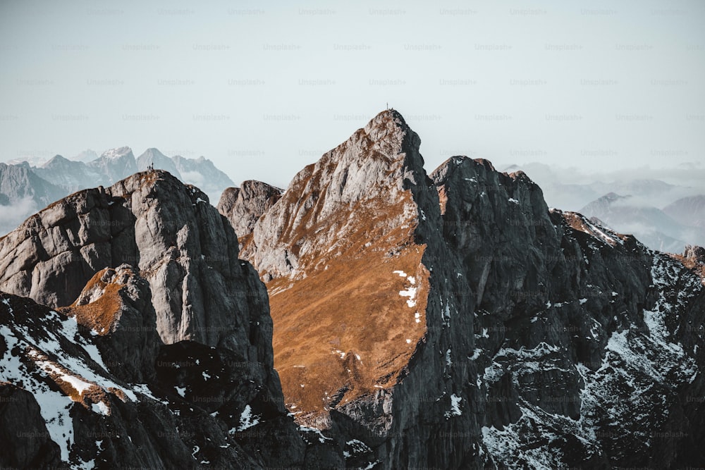 a group of mountains with snow on them