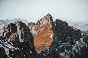 a group of mountains with snow on them