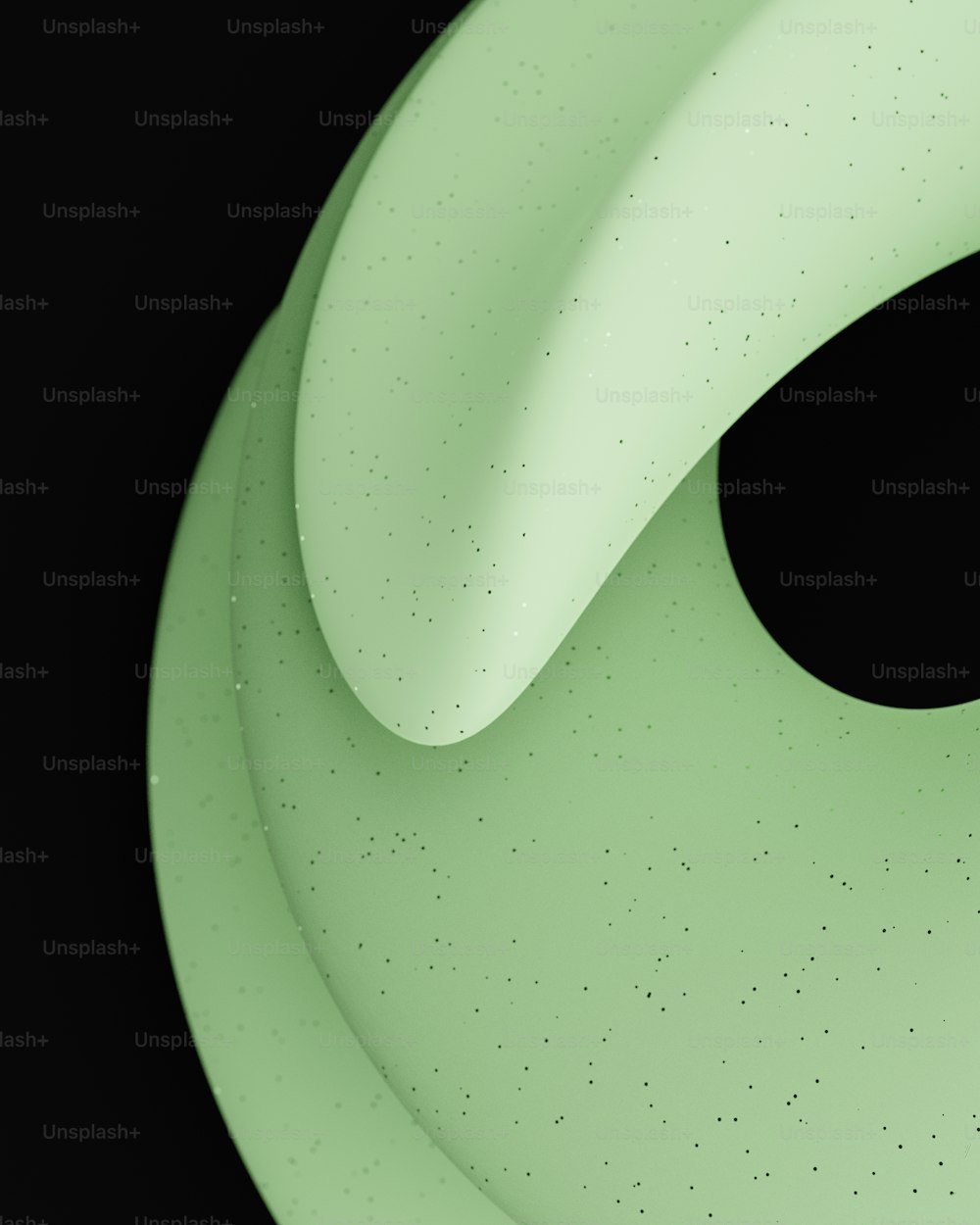 a close up of a green object with a black background