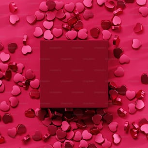 a red box surrounded by hearts on a pink background