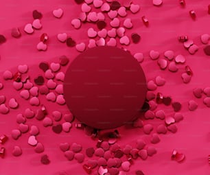 a round object surrounded by hearts on a pink background