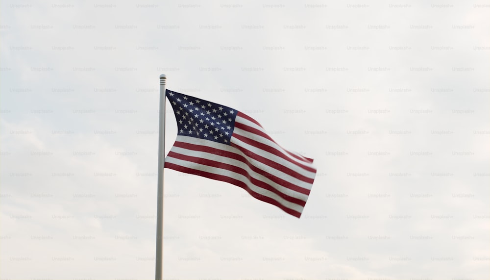 an american flag is flying in the wind