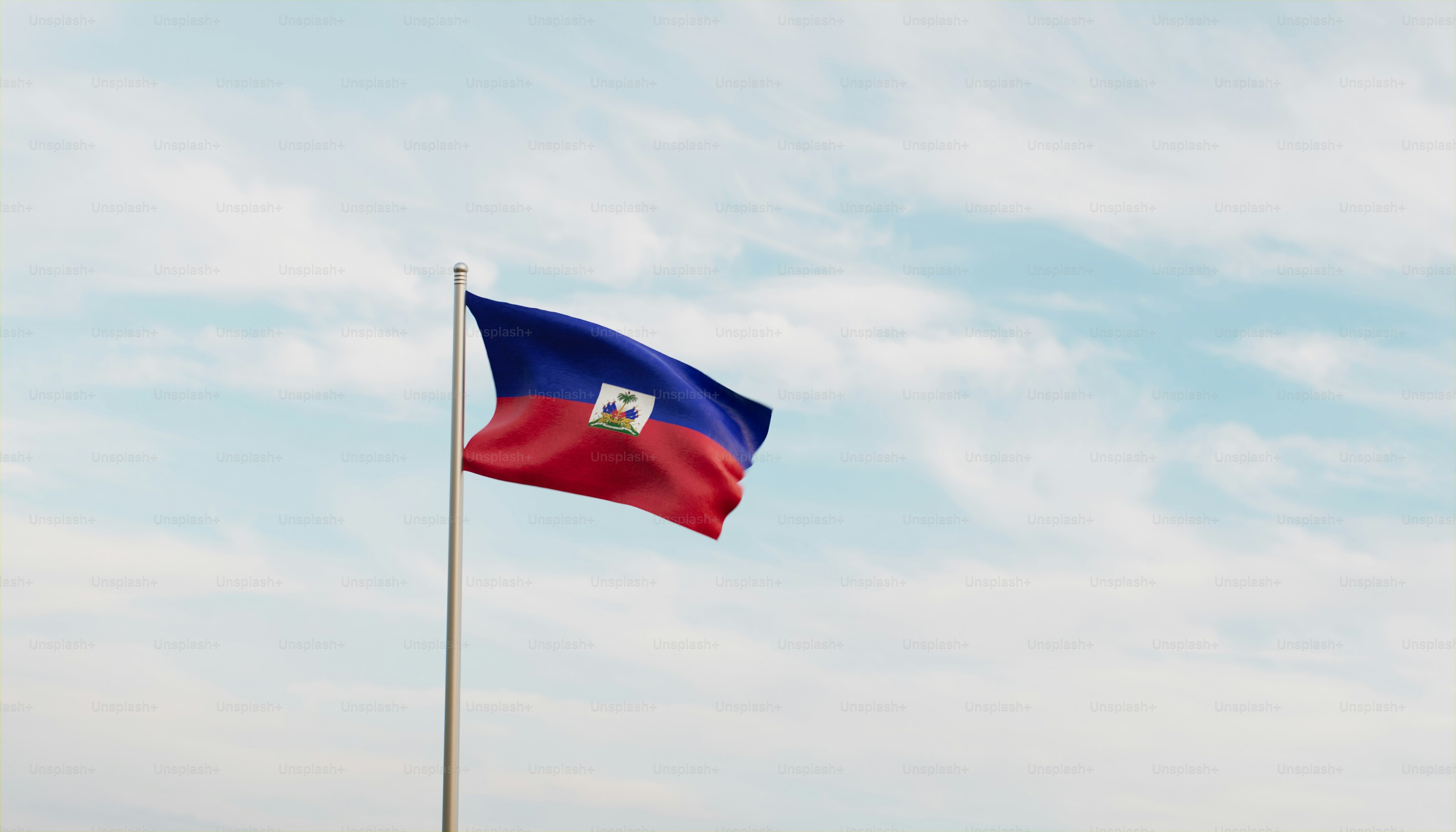 a flag flying in the wind with a blue sky in the background