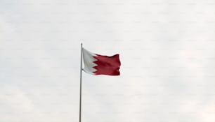 a flag flying in the wind on a cloudy day