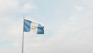 a flag waving in the wind on a cloudy day