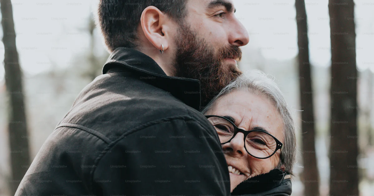 A man hugging a woman in the woods photo – Match Image on Unsplash