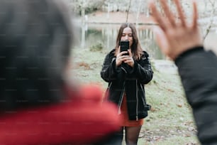 a woman taking a picture of herself in a mirror