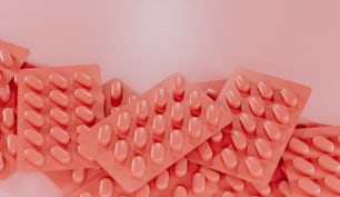 a pile of pink pills sitting on top of each other