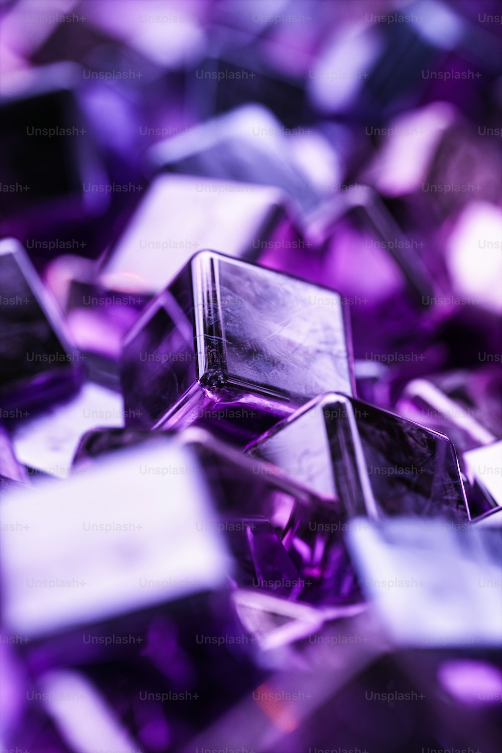 a pile of purple glass cubes sitting on top of each other