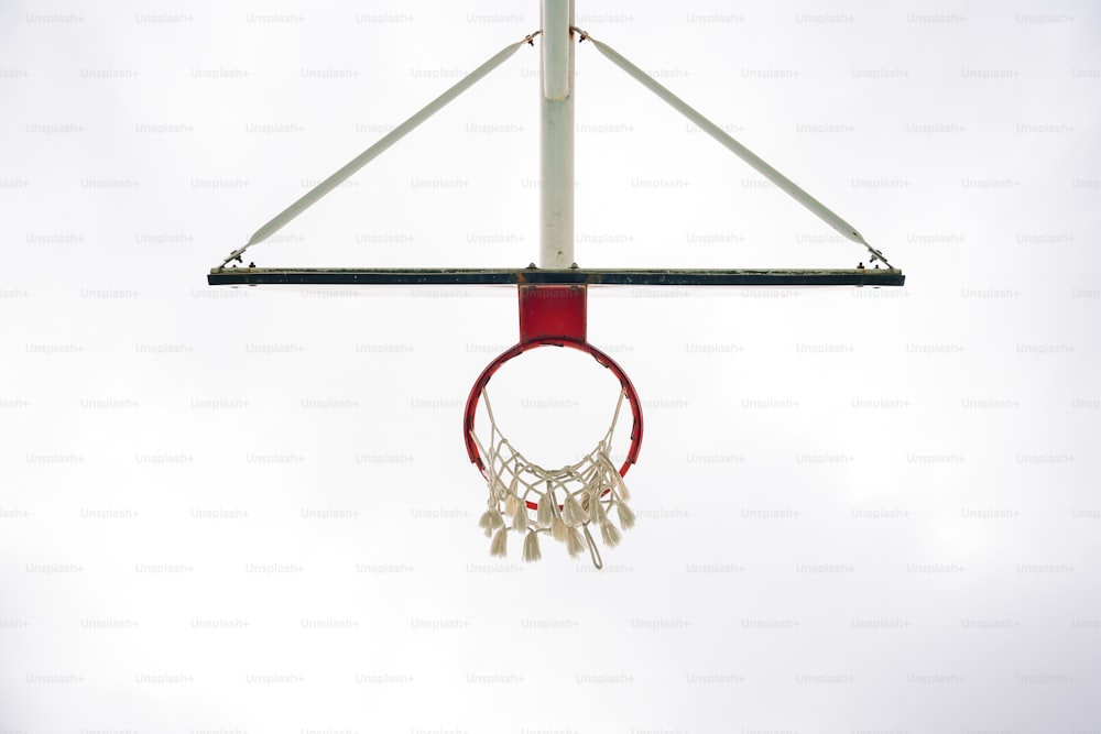 a basketball hoop with a basketball hanging from it