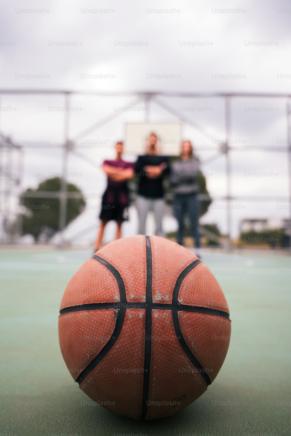 a basketball sitting on top of a basketball court