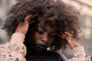 a close up of a person with curly hair