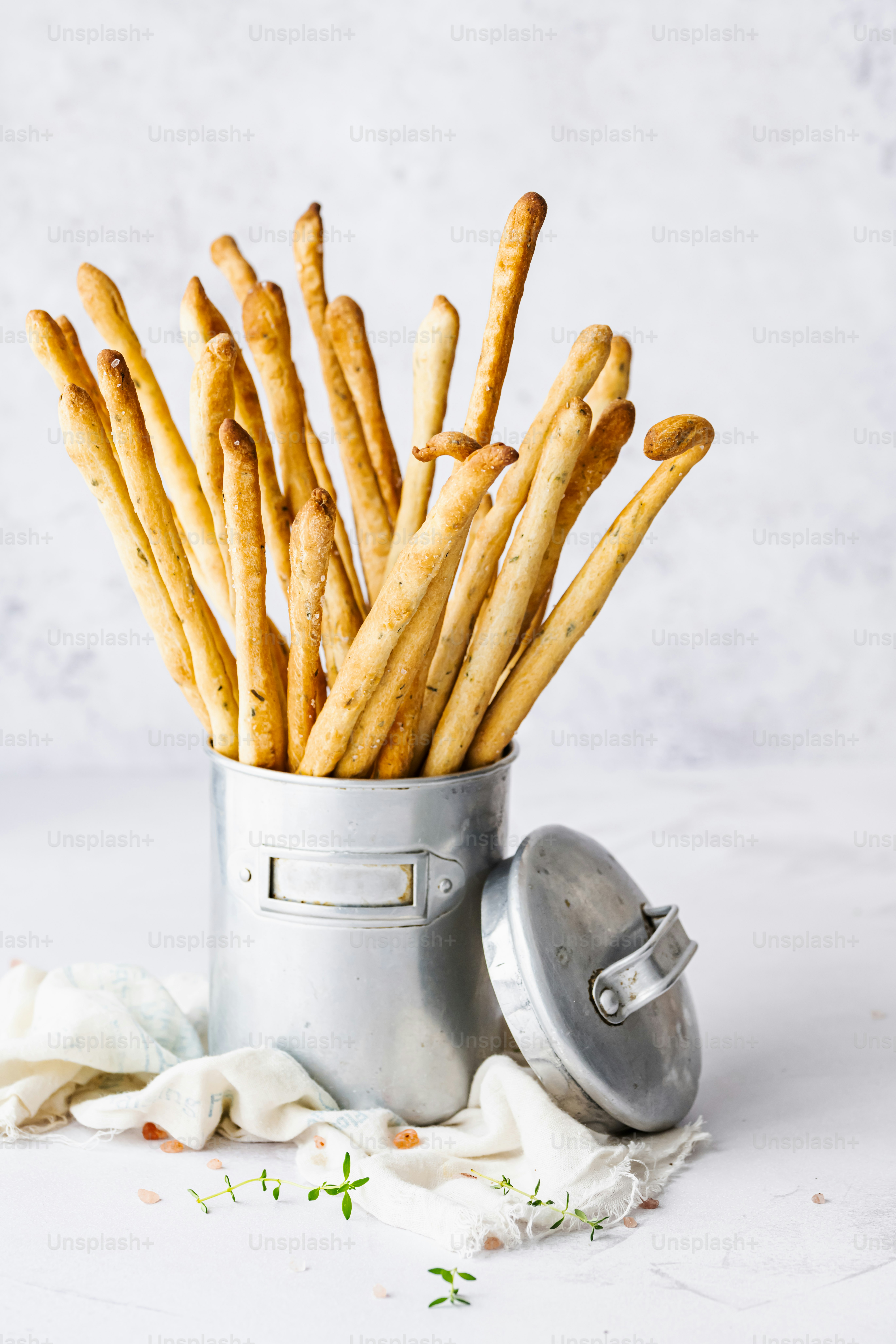 a can filled with crackers sitting on top of a table