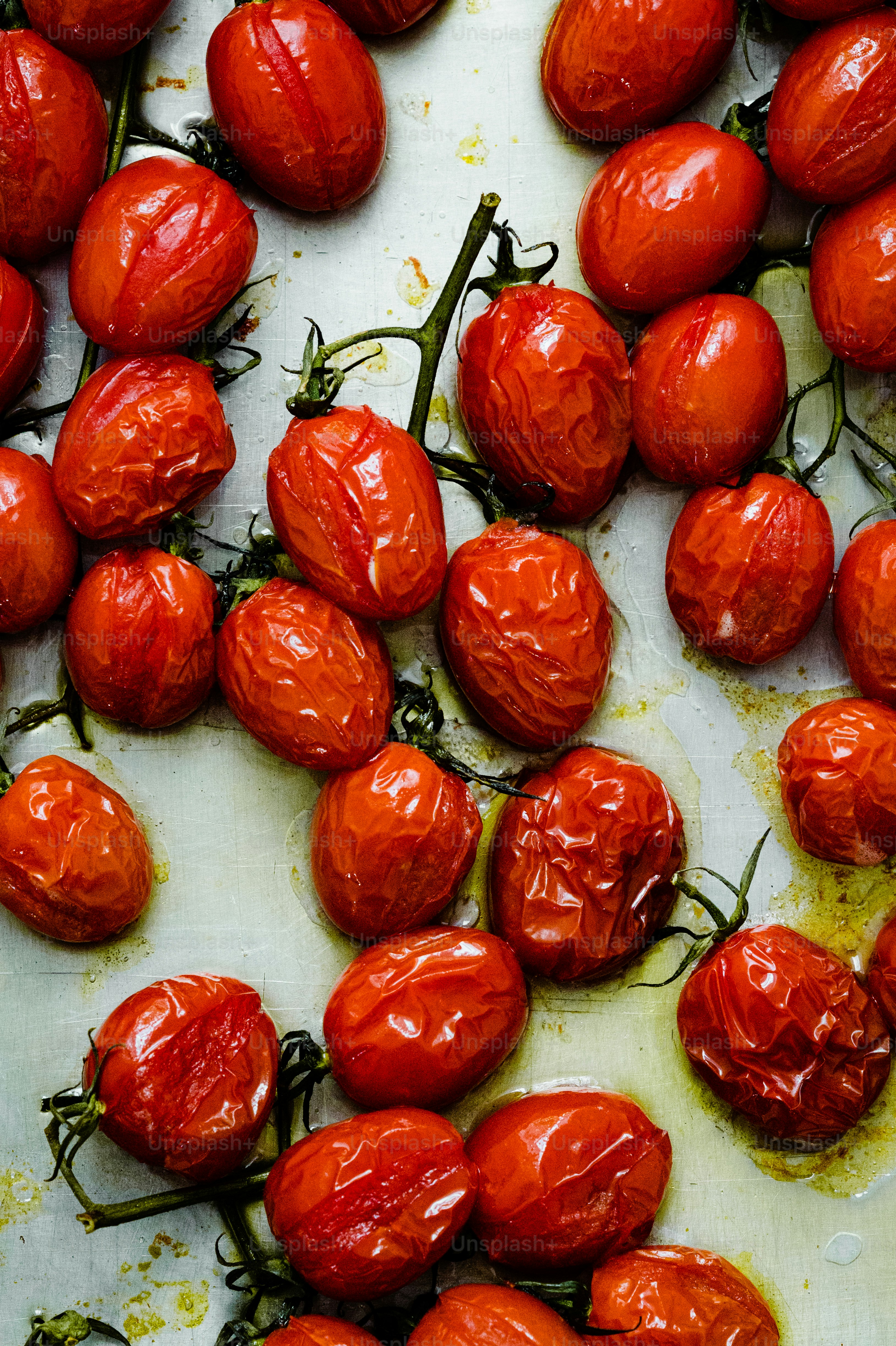 a bunch of tomatoes that are on a table