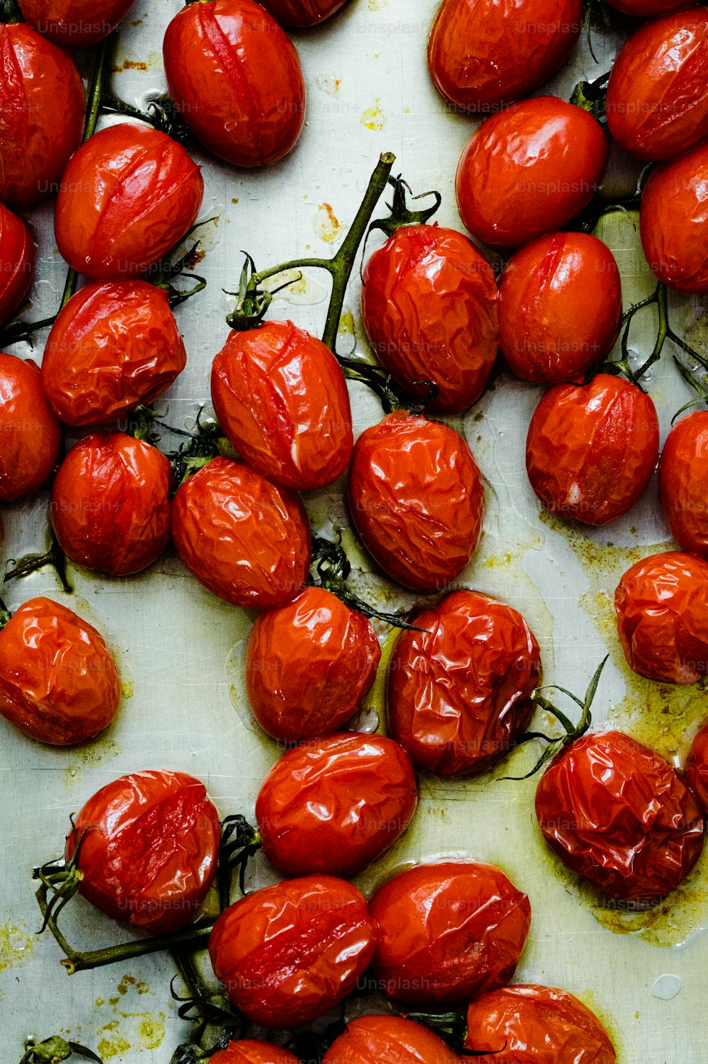 a bunch of tomatoes that are on a table