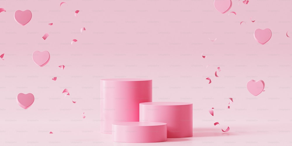 a couple of pink vases sitting on top of a table