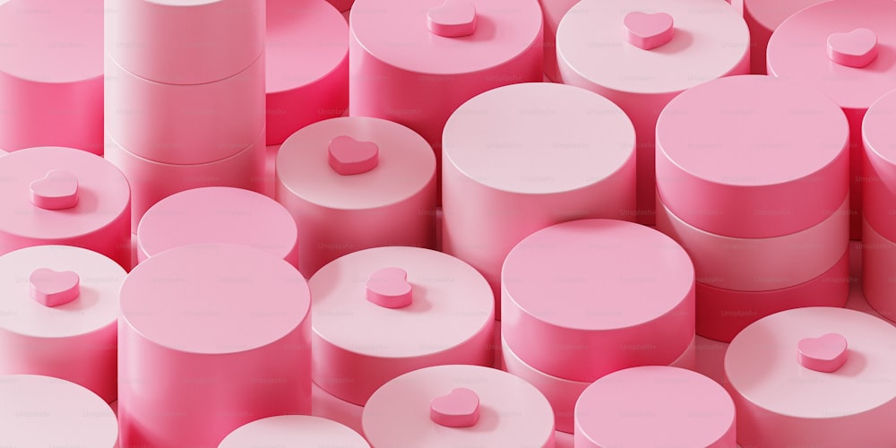 a large group of pink cylinders with hearts on them