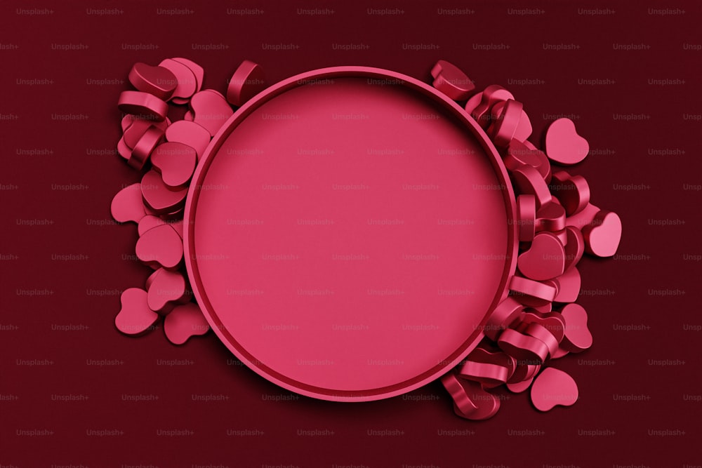 a pink plate with hearts around it on a red background