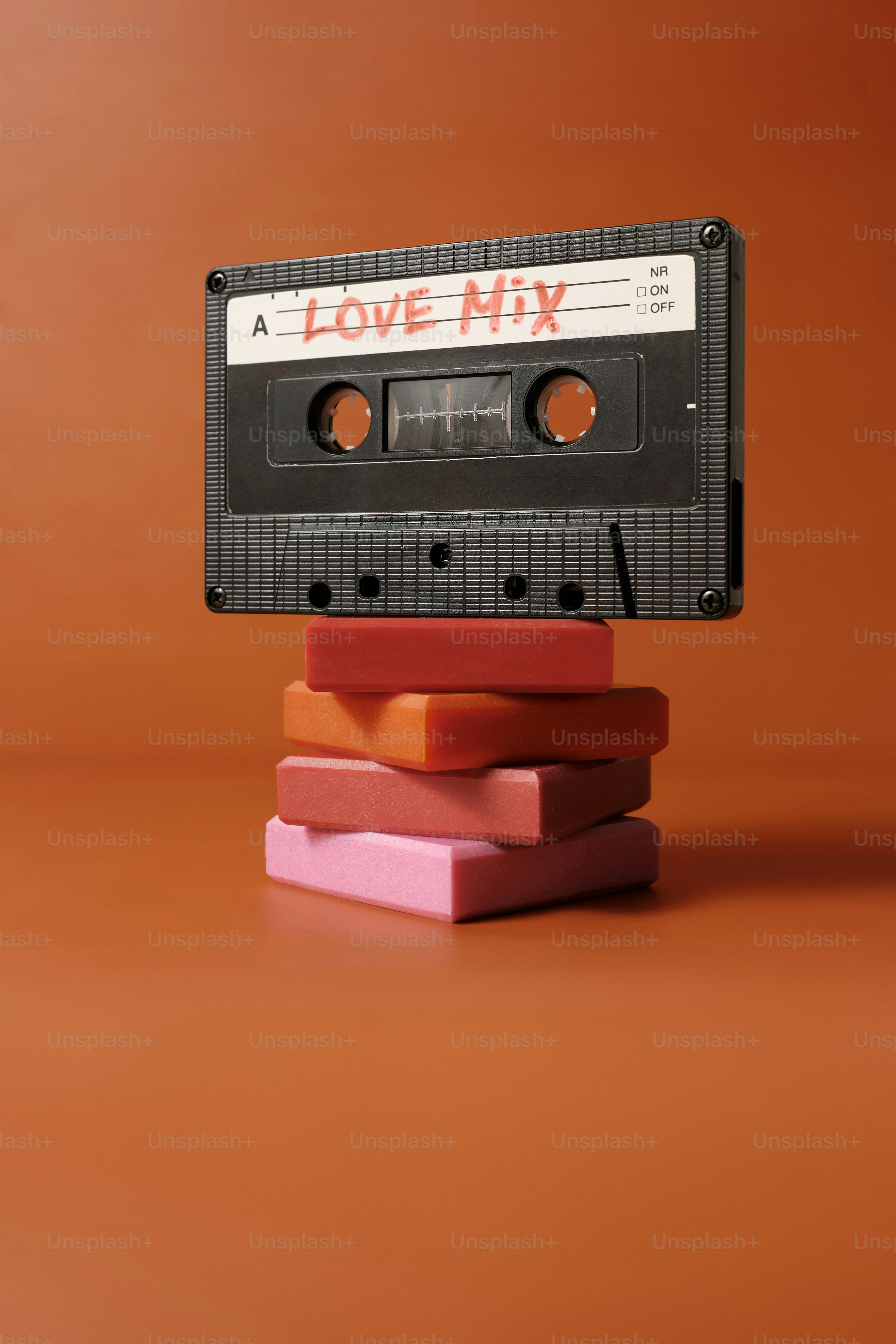 A modern St. Valentines background a black old cassette with the love music mix