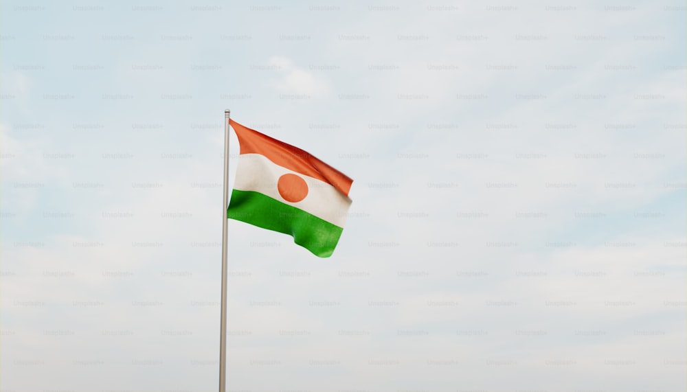 a flag flying in the wind with a sky background