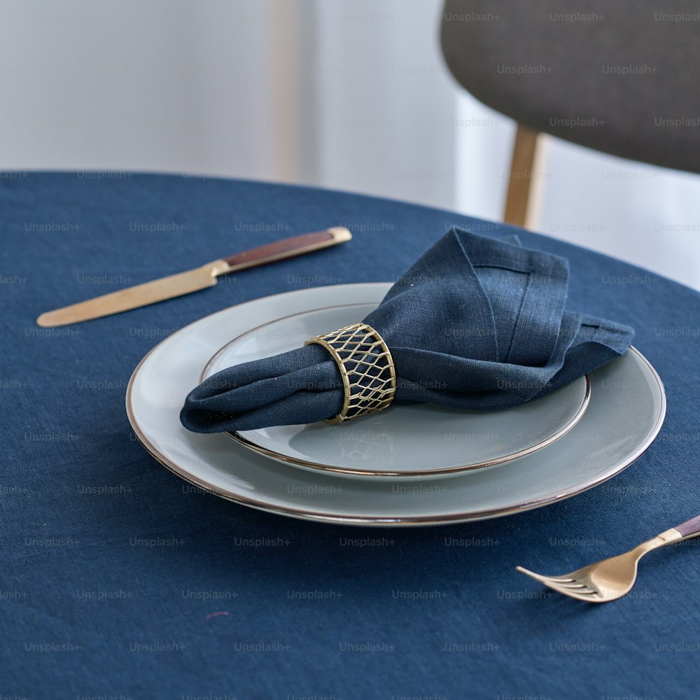 a blue table cloth with a napkin on it