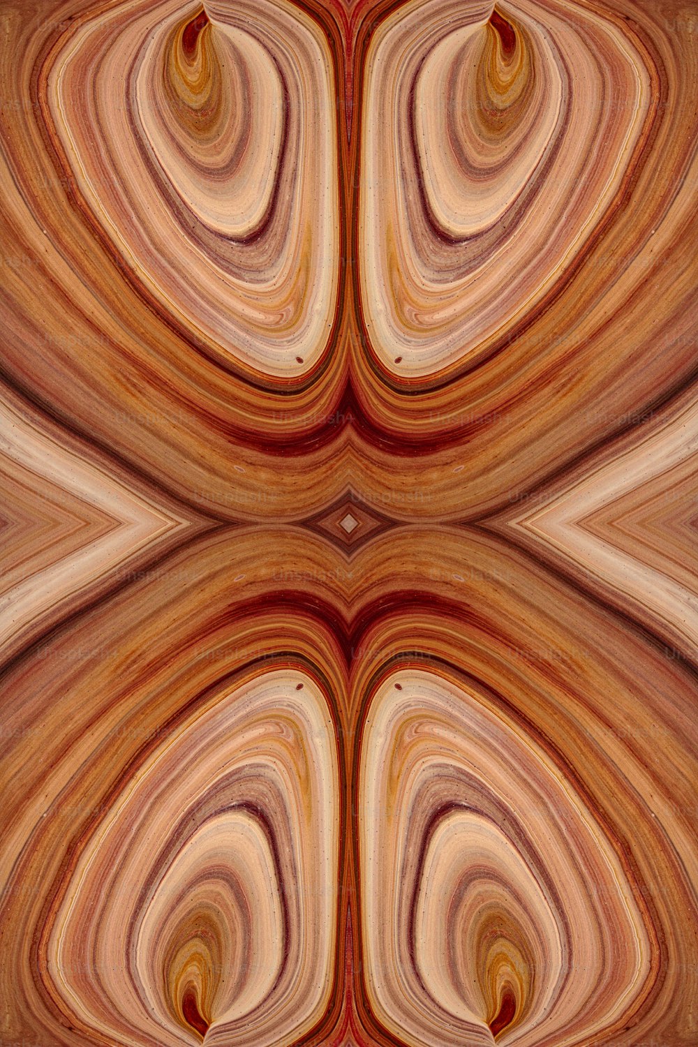 Una imagen abstracta de un remolino marrón y rojo