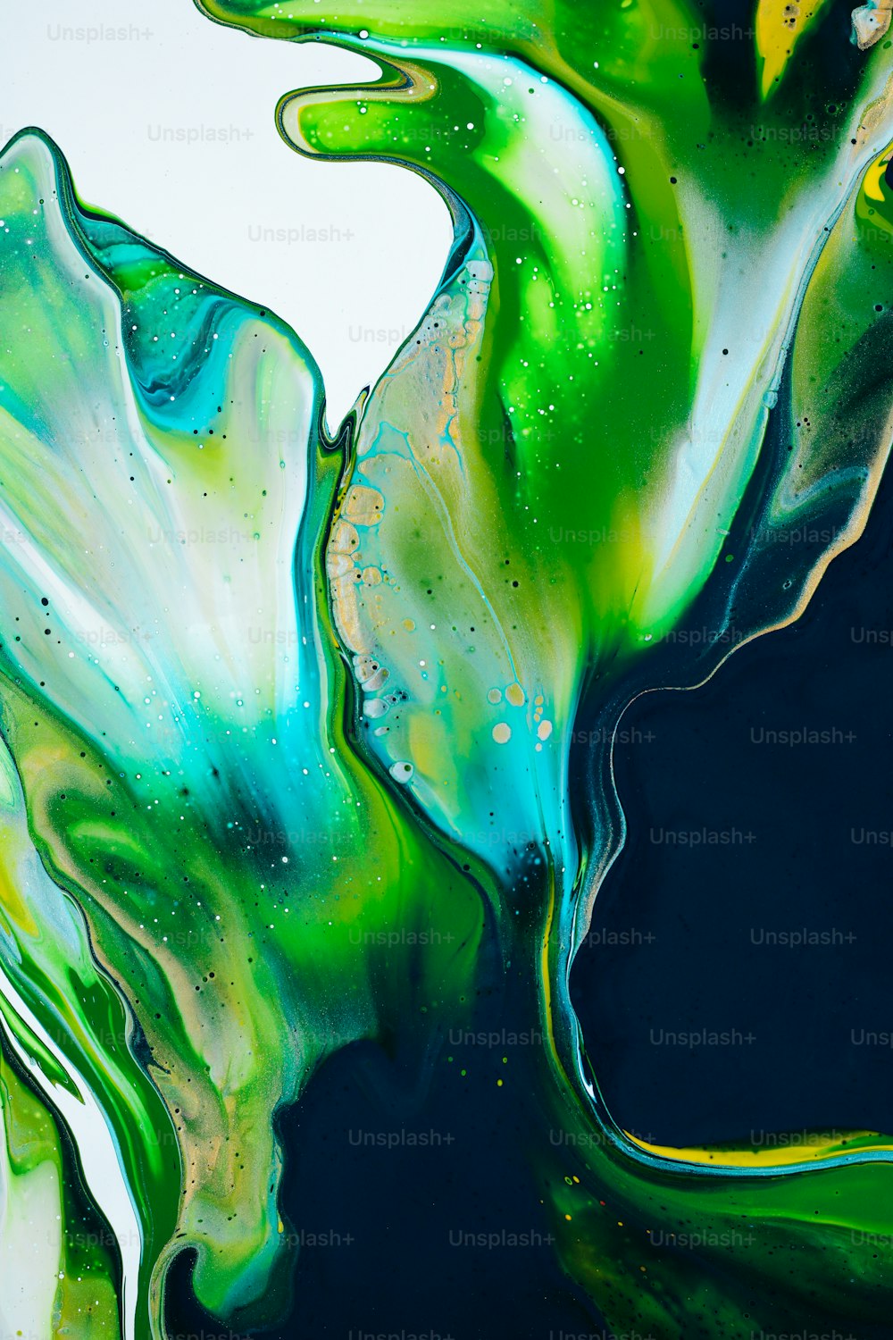 a close up of a green and blue liquid