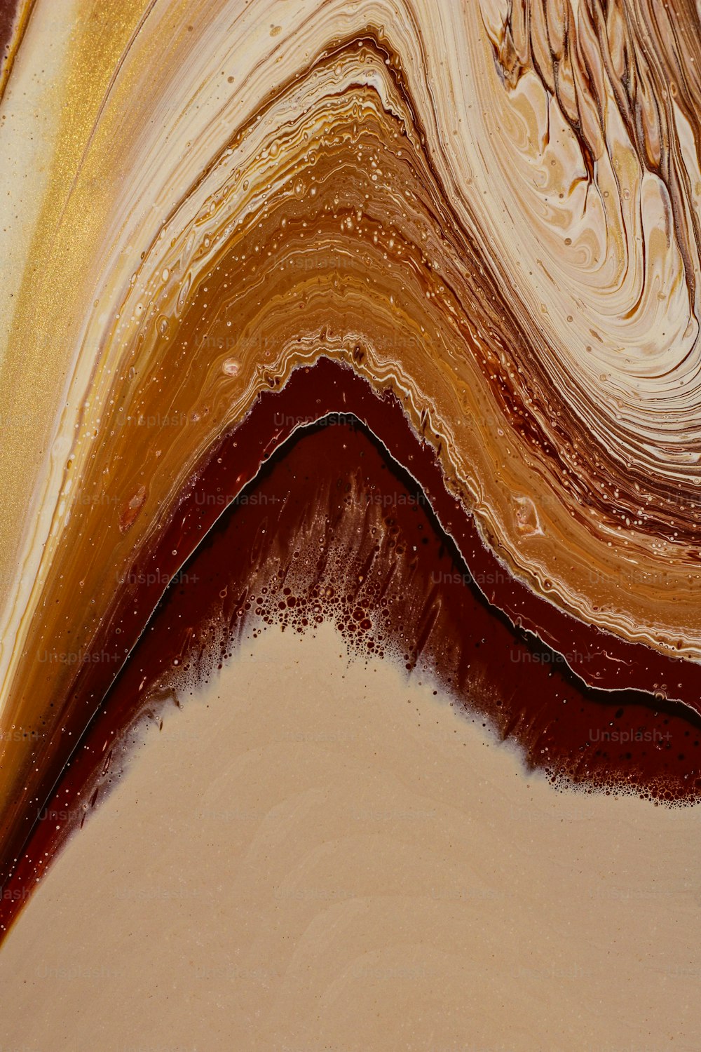 a close up of a brown and white swirl