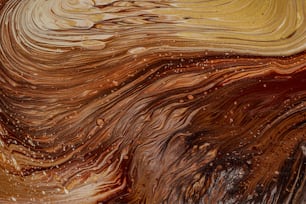 a close up of a brown and white swirl