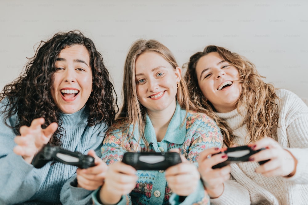 three women are playing a video game together