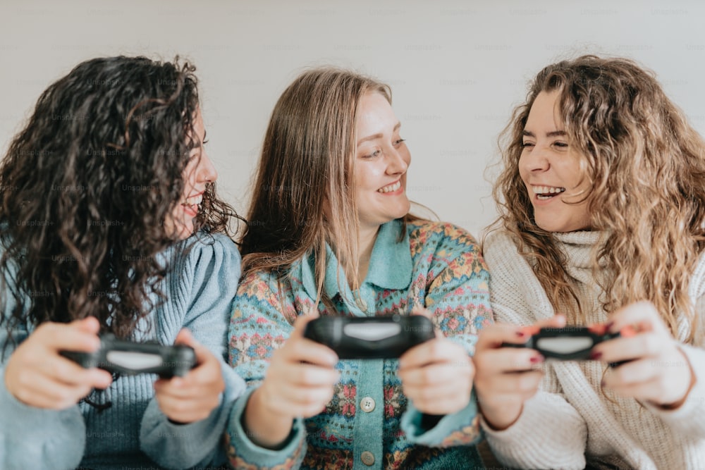 a group of women playing a game with remote controllers