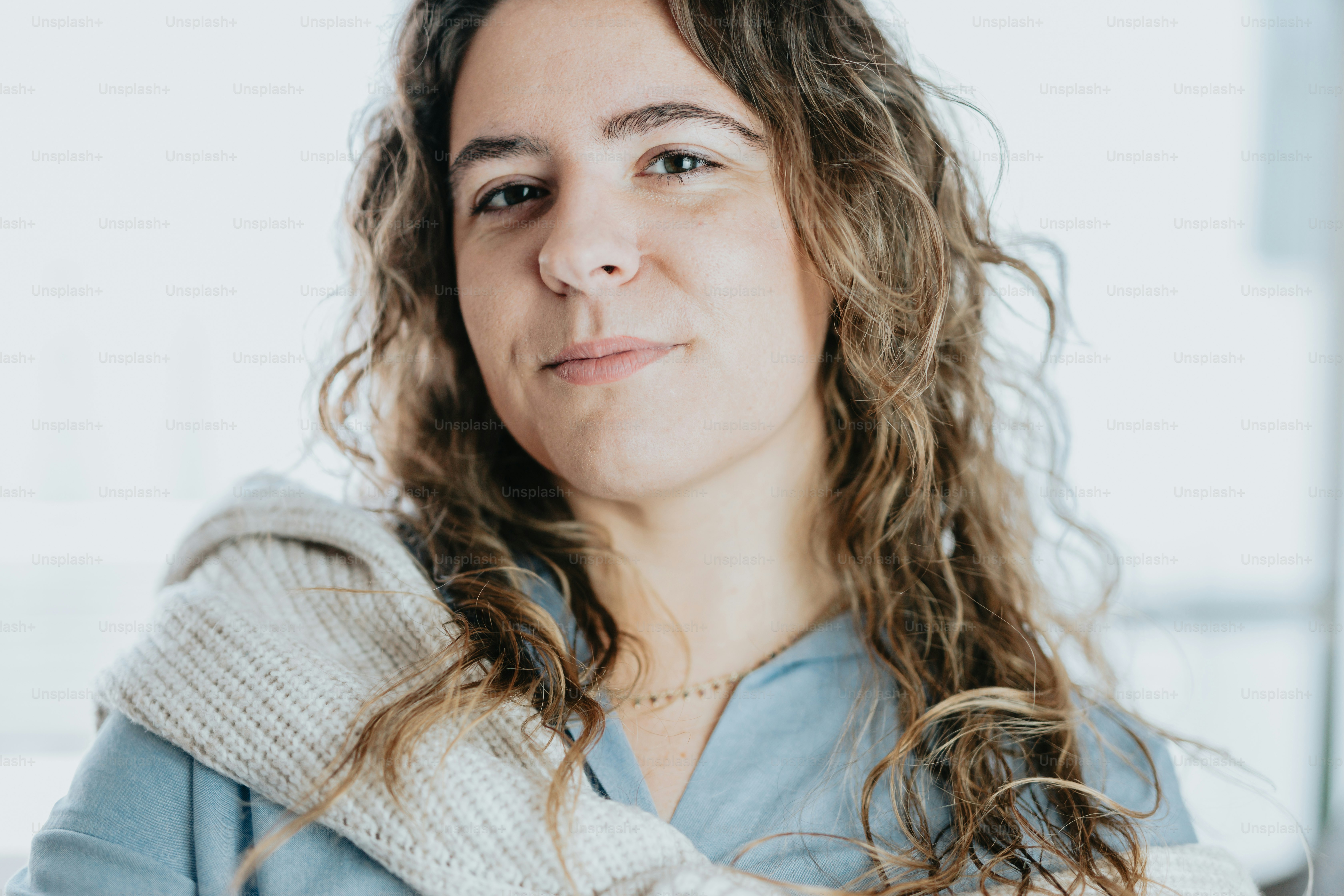 a close up of a person wearing a scarf