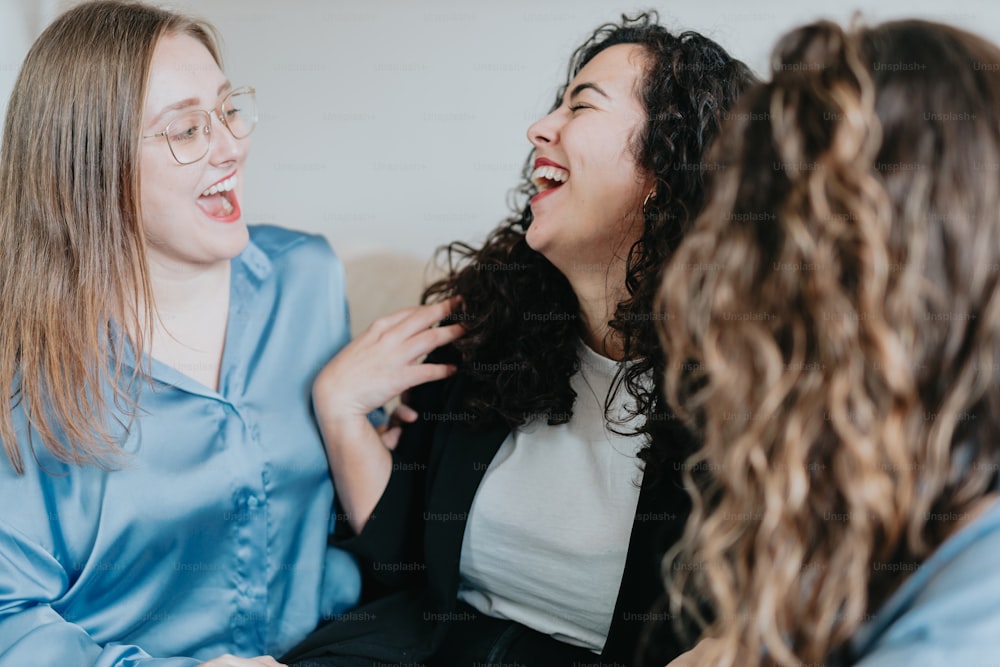 two women laugh as they talk to each other