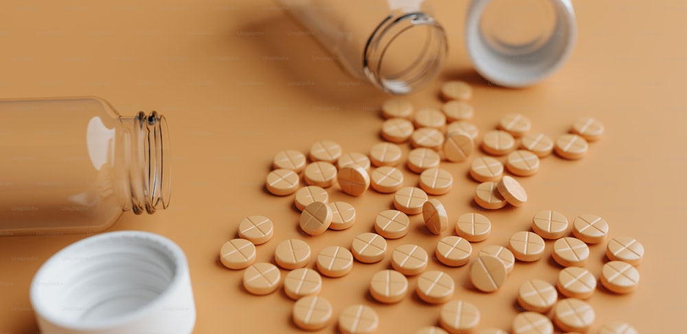 pills spilled out of a bottle onto a table