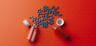pills spilling out of a bottle onto a red background