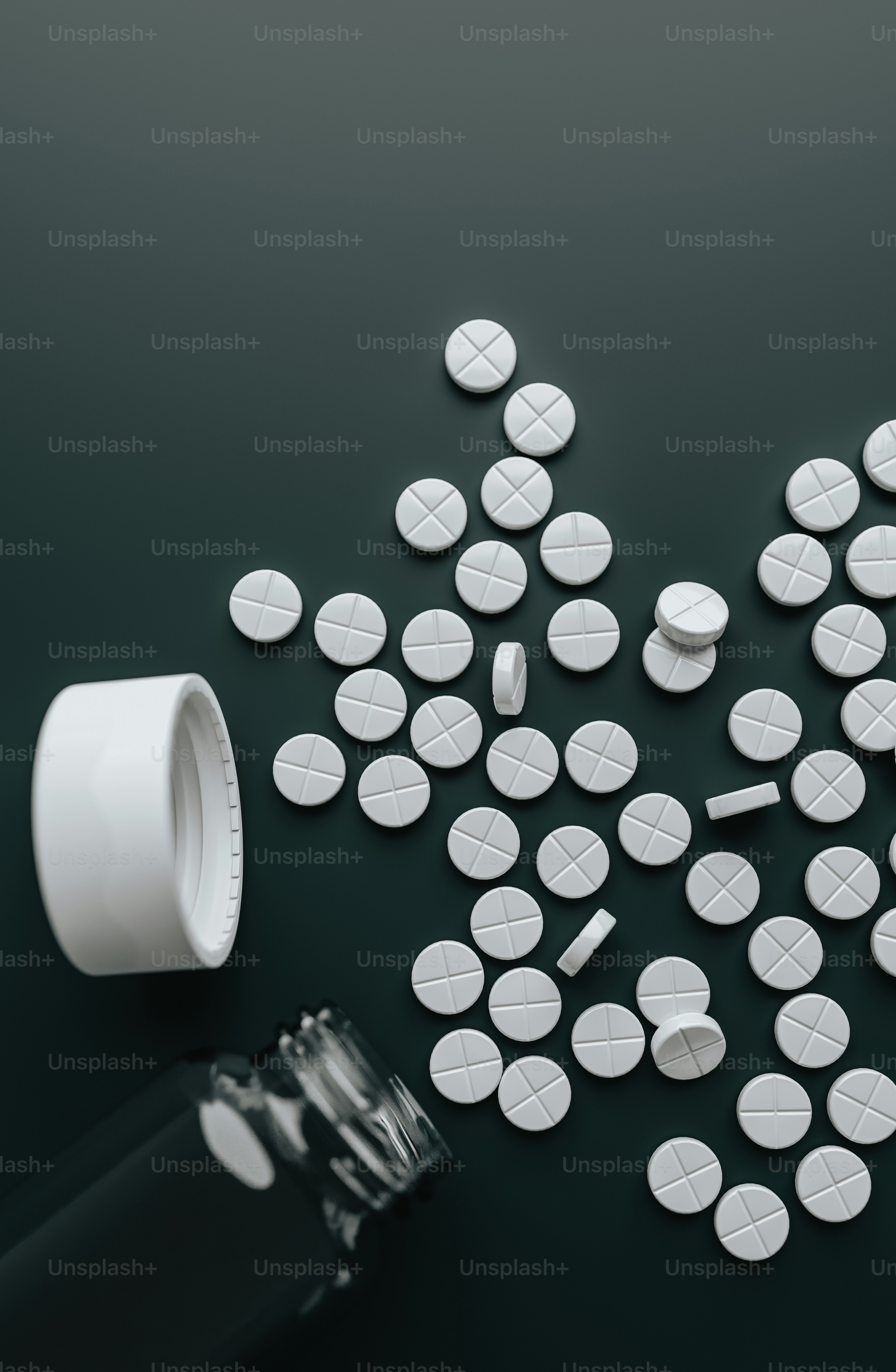 pills spilling out of a bottle onto a table