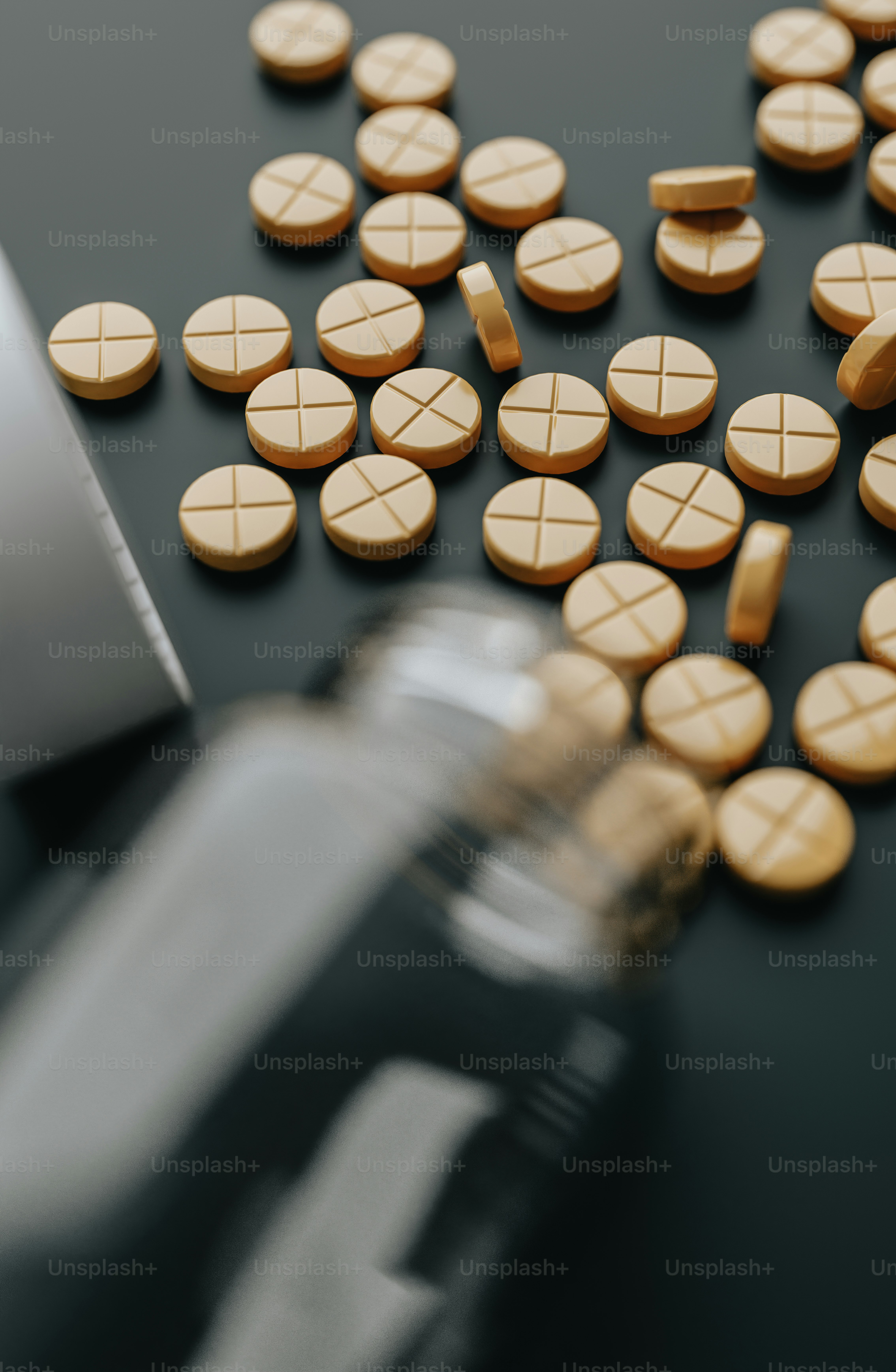 pills spilled out of a bottle onto a table