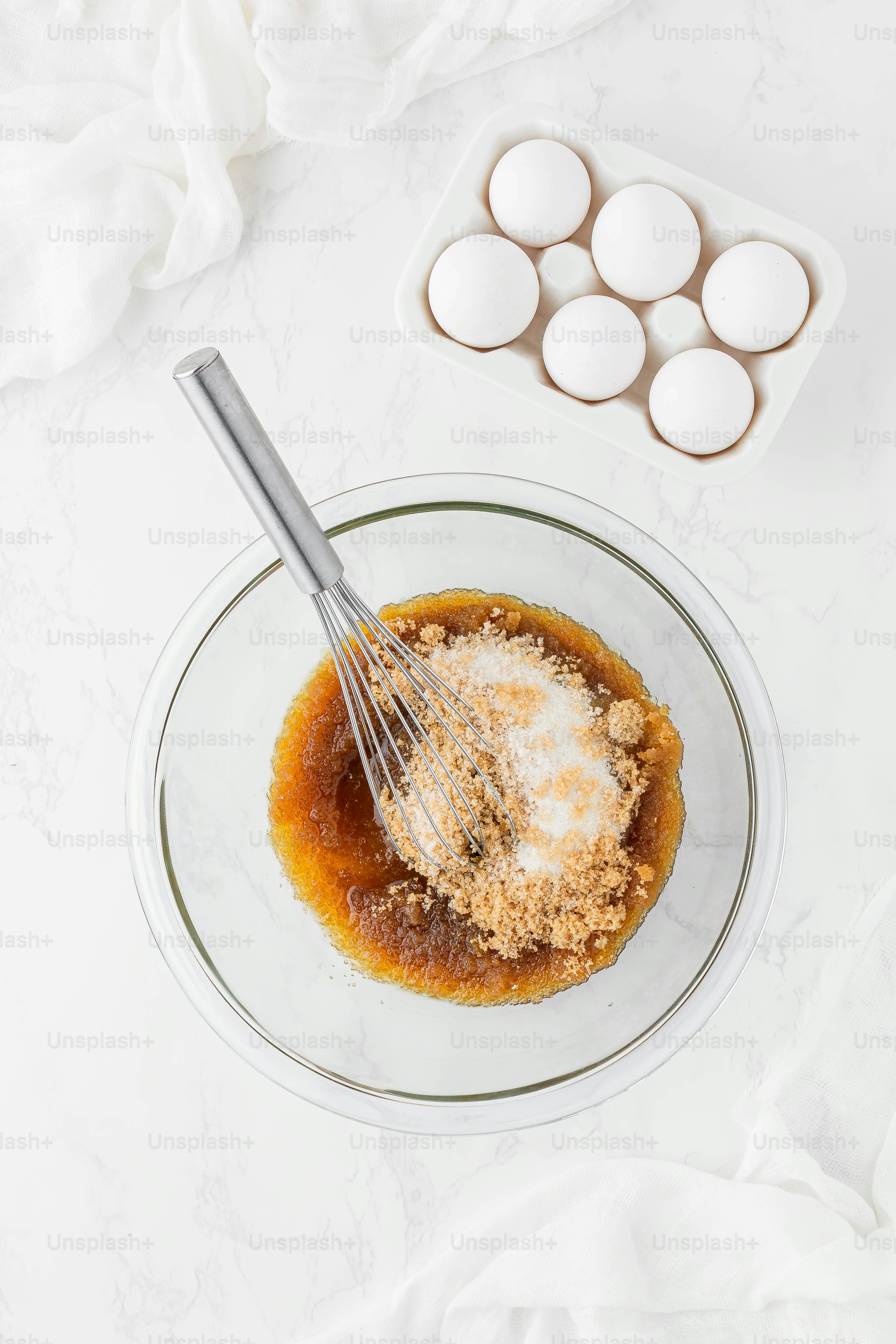 a bowl of food with a whisk in it