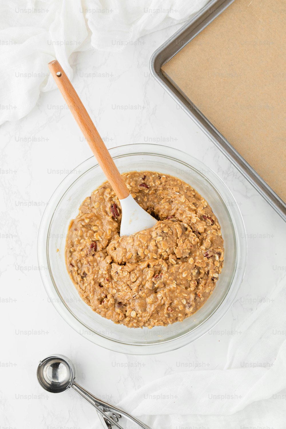 a bowl of oatmeal with a wooden spoon