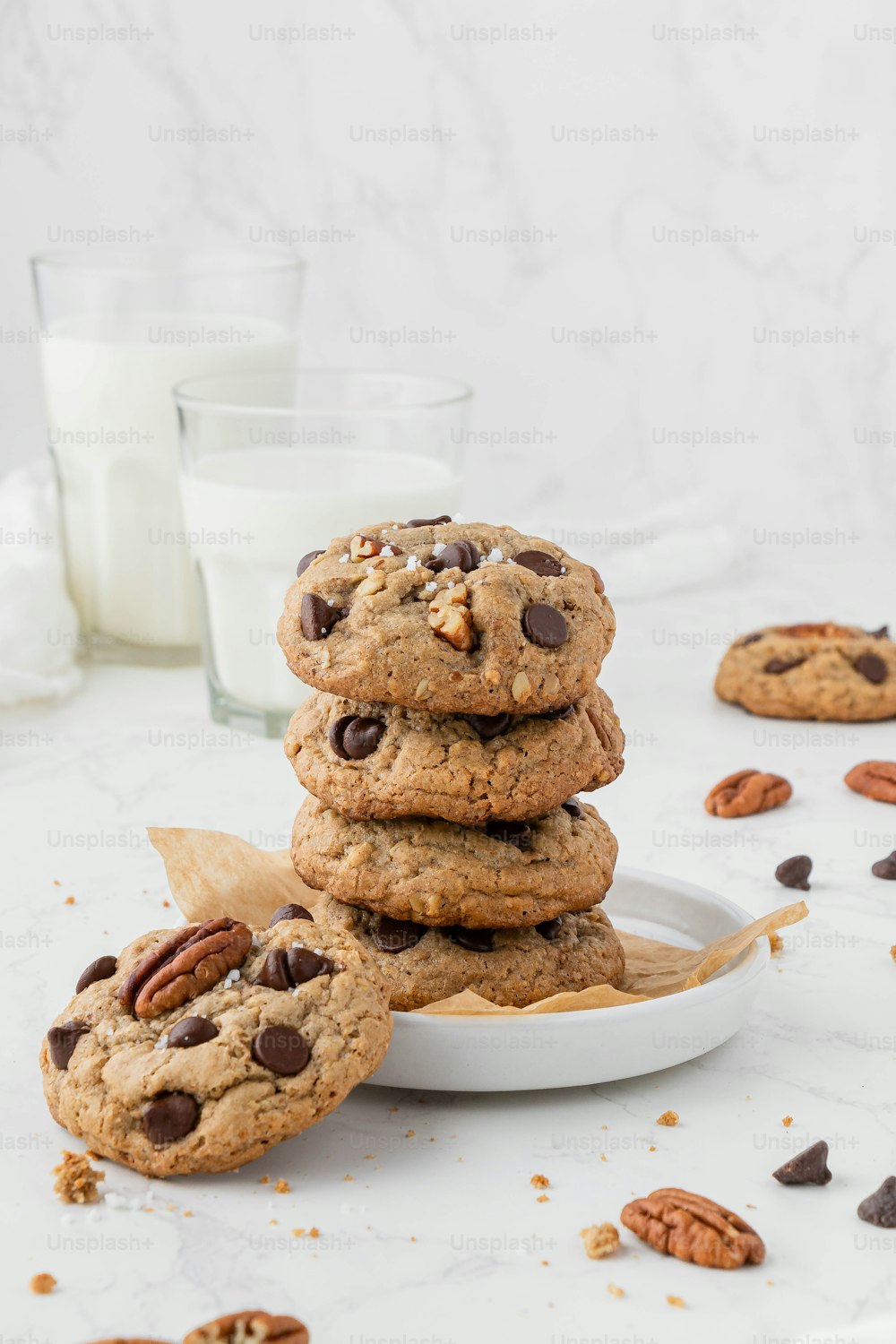 a stack of cookies sitting on top of a white plate