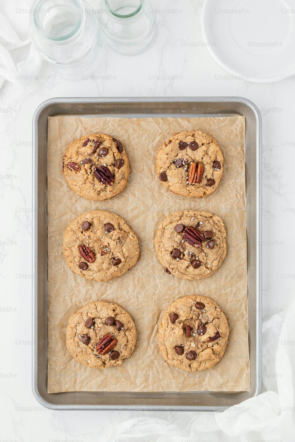 a tray of cookies with pecans and pecans on top