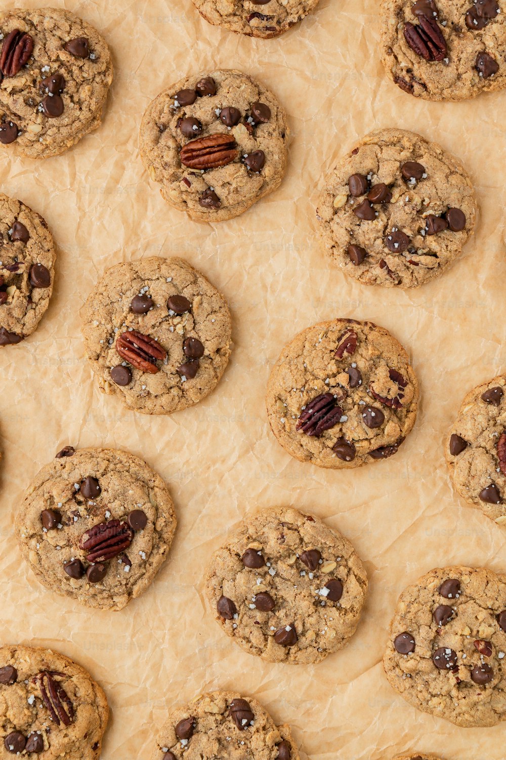 chocolate chip cookies with pecans and pecans on top