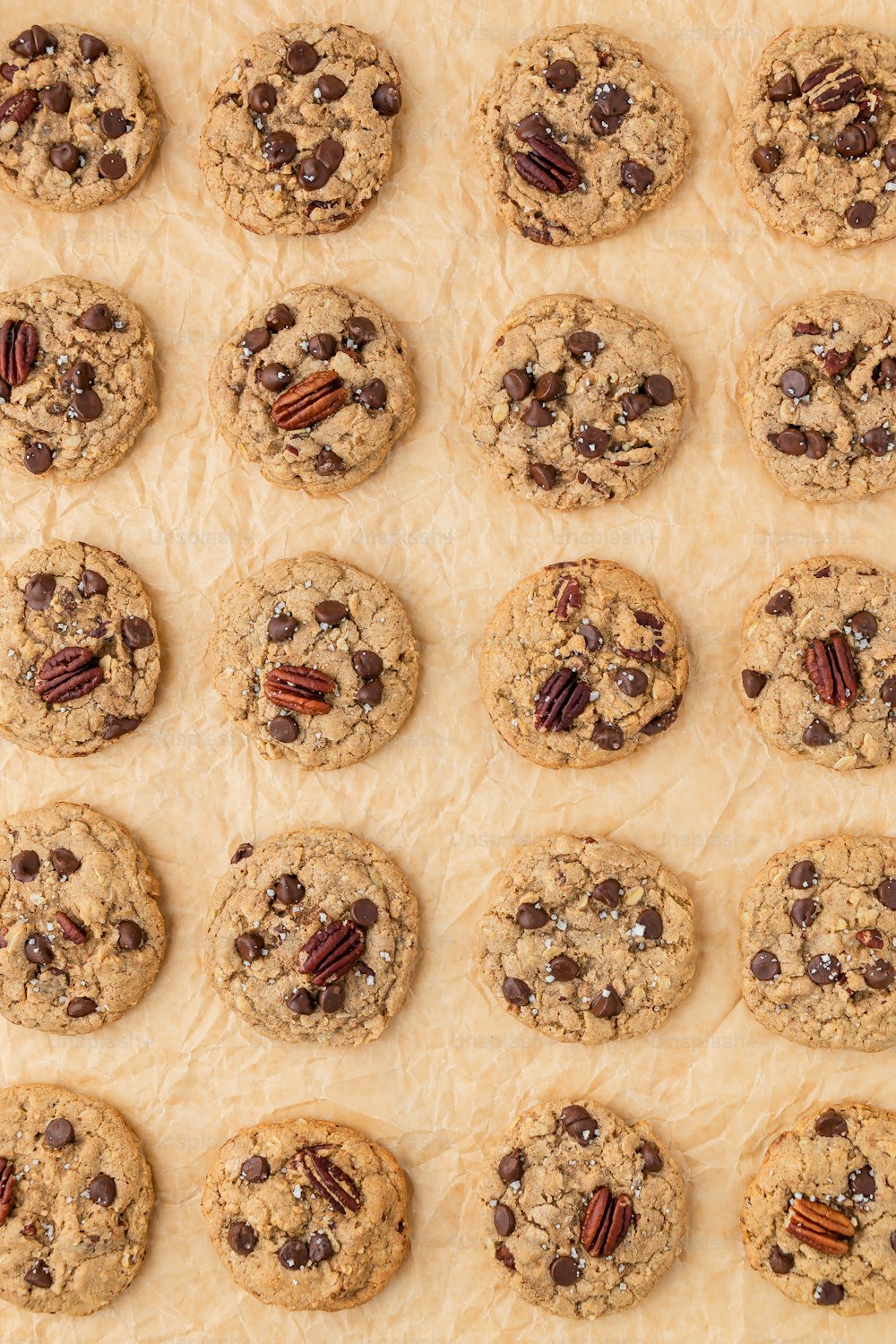 a tray of cookies with pecans and chocolate chips